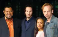  ?? AP PHOTO/KOJI SASAHARA, FILE ?? In this May 2003 file photo, cast members Laurence Fishburne, from left, Keanu Reeves, Jada Pinkett Smith and Hugo Weaving pose to promote their latest film, "Matrix Reloaded," the second film from "The Matrix" franchise, in Tokyo. The Hollywood...