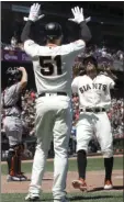  ??  ?? San Francisco Giants’ Mac Williamson (51) celebrates with Hunter Pence (right) after both scored against the Miami Marlins during the sixth inning of a baseball game in San Francisco, Wednesday. AP PHOTO/JEFF