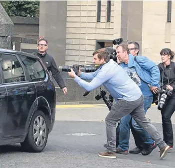  ??  ?? Harry Clarke departs Glasgow Sheriff Court in the back seat of a car after giving evidence to an inquiry into the tragedy, bottom right.