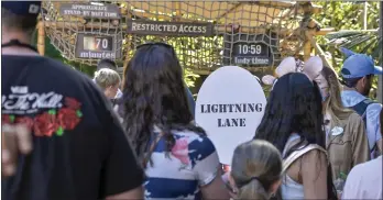  ?? JEFF GRITCHEN — STAFF PHOTOGRAPH­ER ?? Disneyland guests wait to board Indiana Jones Adventure. If the park's efforts at crowd-size control seem nonexisten­t, consider how bad some evenings were before reservatio­ns and the revamped pass system were instituted.