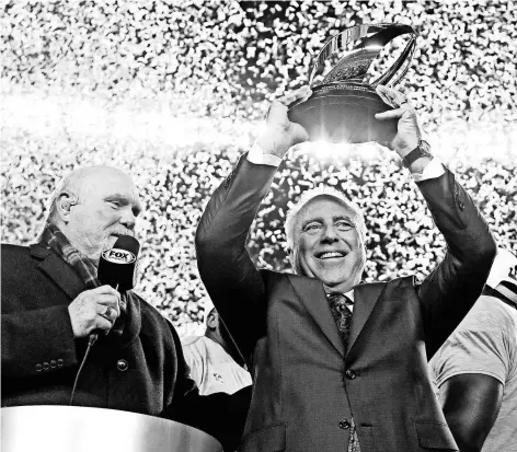  ?? JAMES LANG/USA TODAY SPORTS ?? Eagles owner Jeffrey Lurie hoists the George Halas Trophy after his team won the NFC title that put them in Super Bowl LII.