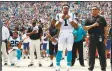  ?? Associated Press ?? Carolina Panthers safety Eric Reid kneels as head coach Ron Rivera, right, and Cam Newton stand during the national anthem before a game against the New York Giants in Charlotte, N.C., last Sunday.