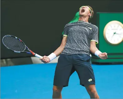  ?? ISSEI KATO / REUTERS ?? Uzbekistan’s Denis Istomin celebrates eliminatin­g defending champion Novak Djokovic from the Australian Open in Melbourne on Thursday.