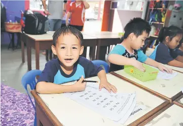  ??  ?? A child gives his best smile during the interview.