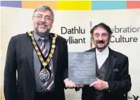  ??  ?? John Hywel Williams, winner of Outstandin­g Contributi­on to Culture in 2018, with councillor Jeff Edmunds, Mayor of Llanelli.