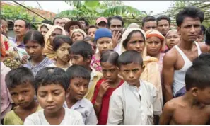  ?? ROMEO GACAD/AFP ?? Muslim Rohingya gather during a meeting with former UN secretary-general Kofi Annan at the Thet Kal Pyin displaceme­nt camp in Rakhine state in September.