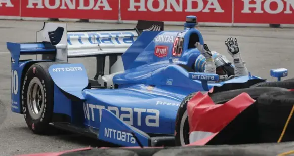  ?? STEVE RUSSELL/TORONTO STAR ?? IndyCar veteran Tony Kanaan loses control and winds up in the tires on the 24th lap of Sunday’s Honda Indy at Exhibition Place. The resulting caution was a turning point in the race.