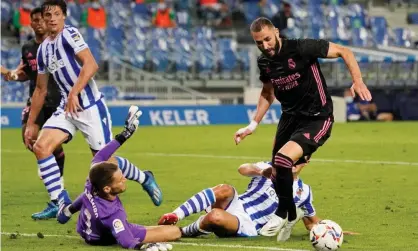  ??  ?? Real Madrid’s Karim Benzema threatens the Sociedad goal. Photograph: Vincent West/Reuters