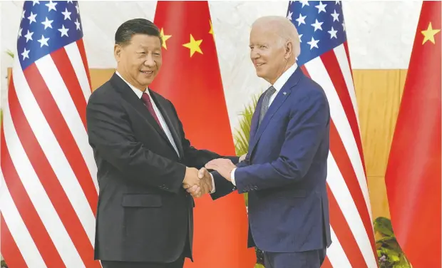  ?? KEVIN LAMARQUE / REUTERS ?? Chinese President Xi Jinping shakes hands with U.S. President Joe Biden on Monday as they meet at the G20 summit in Bali, Indonesia.
