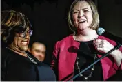  ?? JIM NOELKER / STAFF ?? Former Dayton mayor Nan Whaley laughs with running mate Cheryl Stephens at Montgomery County Democratic Party headquarte­rs after their ticket won the Democratic nomination for governor and lieutenant governor in Tuesday’s primary.