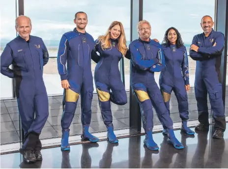  ?? AP ?? Virgin Galactic team from left: chief pilot Dave Mackay, lead engineer Colin Bennett, chief astronaut instructor Beth Moses, founder Richard Branson, vice president of government affairs and research operations Sirisha Bandla and pilot Michael Masucci