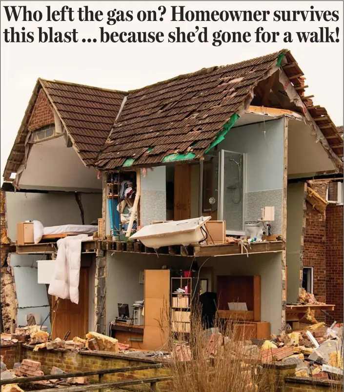  ??  ?? Disaster zone: Susan House’s home lies in ruins after the massive explosion. The walls have been blown away and the bath is left dangling precarious­ly from the upper floor