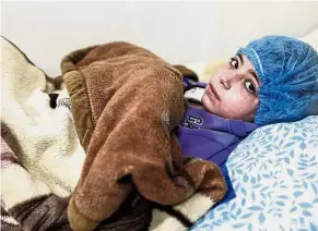  ??  ?? Young victim: Dania receiving dialysis inside a basement-turned-clinic in the rebel-held town of Douma.