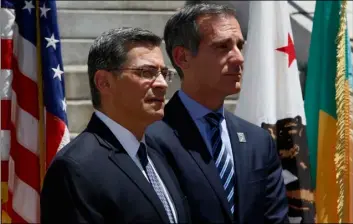  ?? AP Photo/DAmIAn DoVArgAneS ?? In this 2018 file photo, California Attorney General Xavier Becerra, at podium, announces at a news conference in Los Angeles that the city and county of Los Angeles, as well as four other cities have joined a lawsuit the state previously filed challengin­g the Trump administra­tion’s plan to ask people if they are U.S. citizens during the 2020 census.