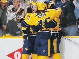  ?? FREDERICK BREEDON/ GETTY IMAGES ?? Nashville Predators players, including Colton Sissons, celebrate one of Sissons’ three goals against the Anaheim Ducks in Game 6 of the Western Conference finals.