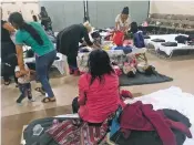  ?? RUSSELL CONTRERAS/ASSOCIATED PRESS ?? Guatemalan migrant Cirila Alejandra Calelpu, front, rests at the Immaculate Heart of Mary Cathedral in Las Cruces last month after she and her 3-year-old daughter were released from detention by U.S. authoritie­s.