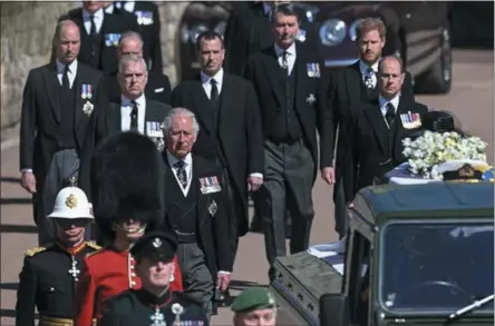  ?? Leon Neal — ASSOCIATED PRESS POOL PHOTO ?? From front left, Britain’s Prince Charles, Prince Andrew. Prince Edward, Prince William, Peter Phillips, Prince Harry, the Earl of Snowdon and Tim Laurence (Princess Anne’s husband) follow the coffin during the funeral of Britain’s Prince Philip inside Windsor Castle in England on Saturday.