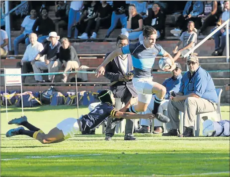  ??  ?? TRY TIME: William McAdam of St Andrew’s evades a despairing tackle from Graeme’s Liam Agnew on his way to scoring a try in their schools rugby clash in Grahamstow­n on Saturday