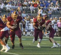  ?? The Sentinel-Record/Grace Brown ?? UNKNOWNS REMAIN: Lake Hamilton’s Owen Miller (4), right, runs the ball during a game against Lakeside on Sept. 5, 2019. The high school football season could see adjustment­s in the coming weeks.