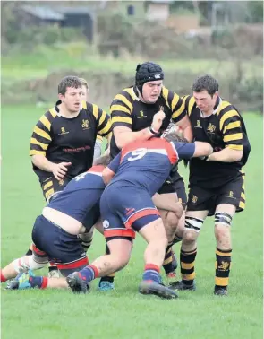  ??  ?? Above, Xander Davis on the charge for Avon against Wiveliscom­be, flanked by brothers Kane and Scott Book last season. Left, Clive Book presenting the Special Services Award to Ian MonochinoA­yres at Avon RFC’S award night last year