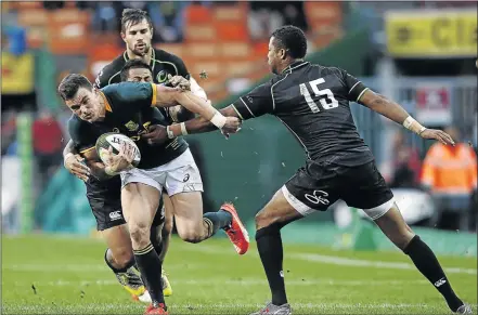  ?? PHOTO: NIC BOTHMA/EPA ?? NO WAYS: Springbok Jesse Kriel is tackled by David Smith of Samoa and Delon Armitage of Trinidad and Tobago during the match between South Africa and a World XV team in Cape Town on Saturday