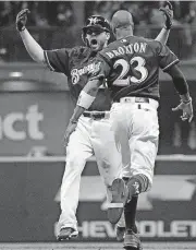  ?? [AP PHOTO] ?? Milwaukee Brewers’ Mike Moustakas hits a walk off RBI single during the 10th inning of Game 1 of the National League Divisional Series baseball game against the Colorado Rockies on Thursday, Oct. 4, 2018, in Milwaukee. The Brewers won 3-2 to take a 1-0 lead in the series.