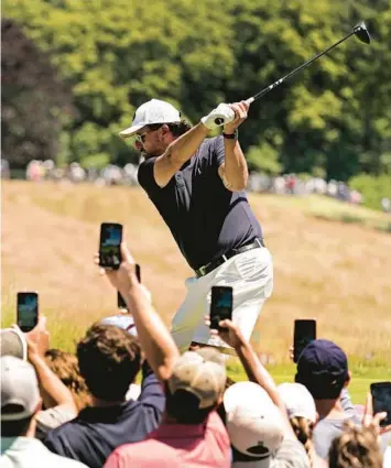  ?? CHARLIE RIEDEL/AP ?? Phil Mickelson hits a tee shot during a practice round Tuesday for this week’s U.S. Open outside of Boston.