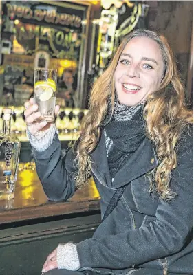  ??  ?? Cheers: Carene Lecaille from Normandy is pictured enjoying a Dingle Gin in the Merchant O’Shea’s Bar in Dublin