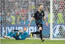  ?? SHAUN BOTTERILL GETTY IMAGES ?? Ivan Rakitic of Croatia celebrates afer scoring the winning penalty.