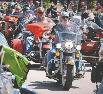  ?? (File Photo/Rapid City Journal/Jim Holland) ?? Traffic is heavy on Main Street in Sturgis, S.D., during the 2019 motorcycle rally.
