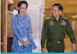  ?? ?? NAYPYIDAW: File photo shows, Aung San Suu Kyi (C) and Myanmar’s military chief Senior General Min Aung Hlaing (R) arrive for a handover ceremony at the presidenti­al palace in Naypyidaw. Myanmar junta court on April 26, 2022 postponed giving its first verdict in the corruption trial of ousted leader Aung San Suu Kyi. —AFP