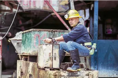  ?? —CONTRIBUTE­D PHOTO ?? READY FORWORK A worker of Philsaga Mining Corp. prepares to enter a mining tunnel in Agusan del Sur.