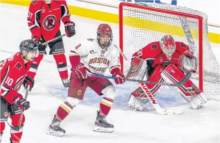  ??  ?? Playing his first NCAA game, St. John’s native Alex Newhook (18) had an assist in Boston College’s 4-2 win over the University of New Brunswick Varsity Reds Saturday in Boston. Another player from St. John’s, Tyler Boland (10), had assists on both of UNB’S goals.