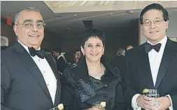  ??  ?? Nasir Noormohame­d and his wife Tazmin Merali, both of
Drug Intelligen­ce Inc., with Henry S. Kim.