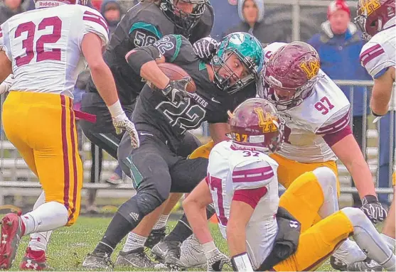  ?? | WORSOM ROBINSON/ FOR THE SUN- TIMES ?? Loyola’s Marty Geary ( 97) pulls down Glenbard West running back Ryan Diver during a Class 8A semifinal Saturday in Glen Ellyn.