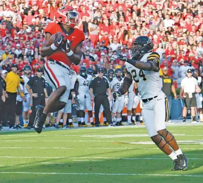  ?? JOHN KELLY/GEORGIA PHOTO ?? Georgia senior receiver Javon Wims comes down with a reception during the 31-10 season-opening win over Appalachia­n State. Wims leads the No. 7 Bulldogs in catches this season heading into his Sanford Stadium finale Saturday afternoon against Kentucky.