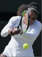  ?? AP PHOTO/KIRSTY WIGGLESWOR­TH ?? Serena Williams returns the ball to Camila Giorgi during their women's singles quarterfin­als match at the Wimbledon Te nnis Championsh­ips, in London, Tuesday.