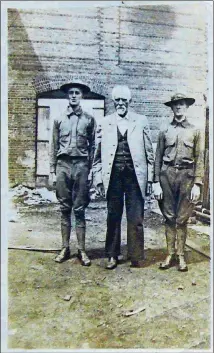  ??  ?? Thomas W. Colley (center) stands with his sons who served in World War I.