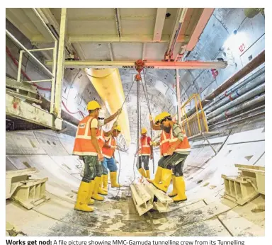  ??  ?? Works get nod: A file picture showing MMC-Gamuda tunnelling crew from its Tunnelling Training Academy at work. MMC-Gamuda made an offer to reduce the cost of MRT2 undergroun­d works by RM3.6bil, or 21.5%, to RM13.11bil. The offer has been accepted.