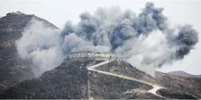  ?? Picture: Reuters ?? UP IN SMOKE. An explosion as part of the dismantlem­ent at a South Korean guard post in the Demilitari­sed Zone dividing the two Koreas in Cheorwon yesterday.