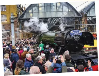  ??  ?? Chuffed to be there: Admirers throng Platform One at King’s Cross Station