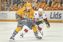  ??  ?? NASHVILLE: Mike Ribiero #63 of the Nashville Predators skates against Zack Smith #15 of the Ottawa Senators during the third period at Bridgeston­e Arena on Tuesday in Nashville, Tennessee. — AFP