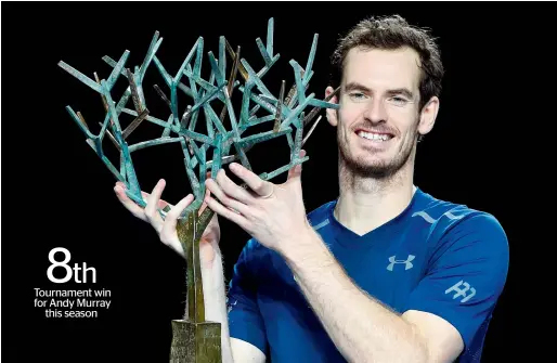  ?? AFP ?? Andy Murray poses with his trophy after winning the final against USA’s John Isner on Sunday. —