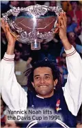  ?? ?? Yannick Noah lifts the Davis Cup in 1991.