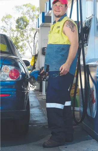  ?? FAIR PRICE: Brendan Wharley fuels up at the Wulguru Mobil. Picture: EVAN MORGAN ??