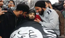  ??  ?? Funeral of militant Mughees Mir whose body was wrapped in an IS flag in Parimpora.