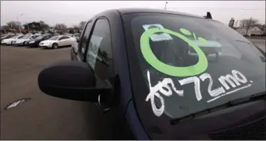  ?? PAUL SANCYA — THE ASSOCIATED PRESS ?? Writing on a GMC Sierra pickup truck at a dealership in Center Line, Mich., advertises 0 percent financing for 72 months. When a car dealer offers to loan you the money to buy a car at zero interest, it gets your attention. Yet that cheap money might...