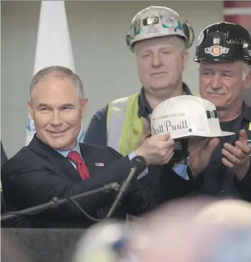  ?? JUSTIN MERRIMAN/GETTY IMAGES ?? U.S. Environmen­tal Protection Agency Administra­tor Scott Pruitt, pictured in April after speaking with coal miners in Pennsylvan­ia, said Monday he will sign a new rule overriding the Clean Power Plan, an Obama-era effort to limit carbon emissions from...