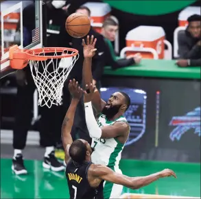  ?? Omar Rawlings / Getty Images ?? The Celtics’ Jaylen Brown drives to the basket over the Nets’ Kevin Durant on Friday in Boston.