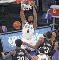  ?? Brad Penner / Associated Press ?? Brooklyn Nets center Deandre Jordan’s (6) dunk near the end of the first half helped the Nets outstrip the Knicks.